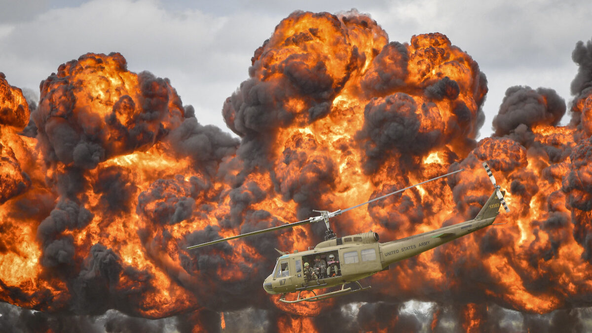 helicopter in front of explosion