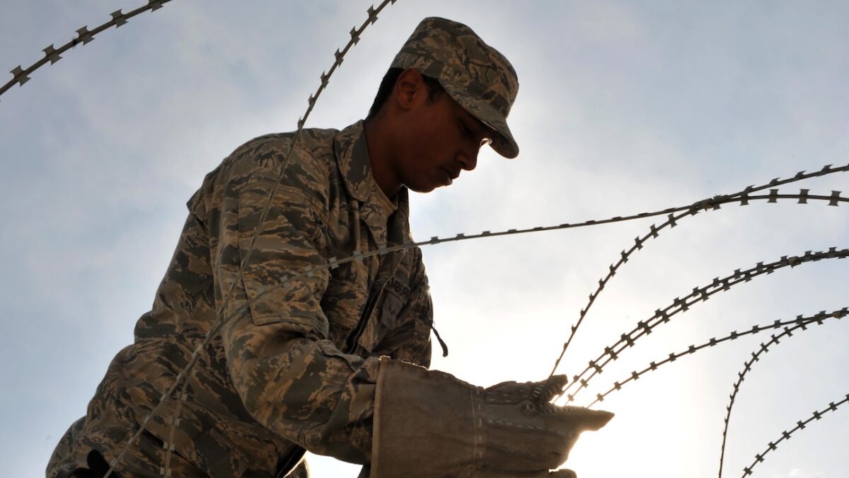 airman installs razor wire