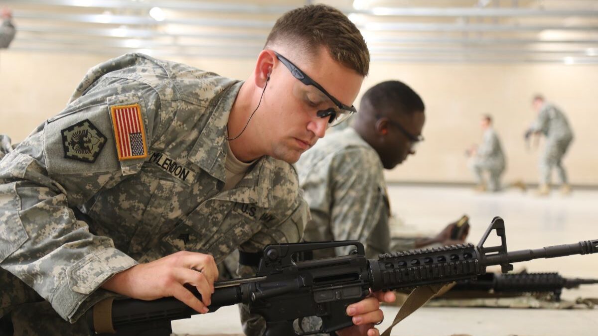 Army soldier target shooting.
