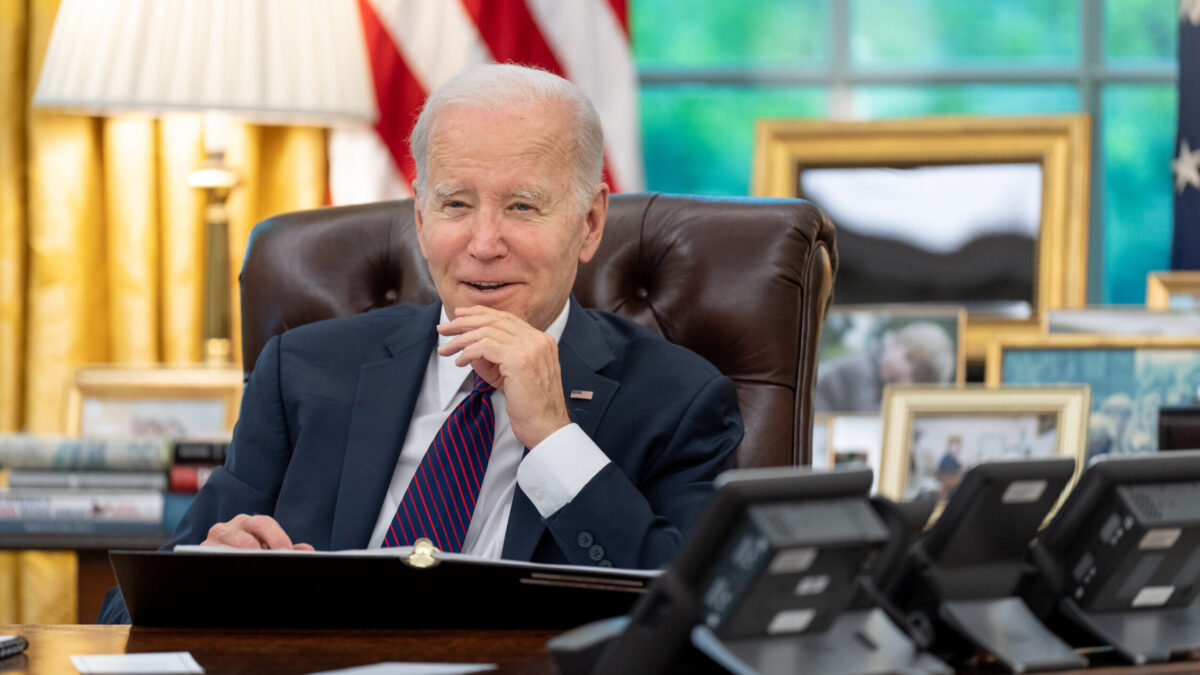 President Joe Biden talks on the phone