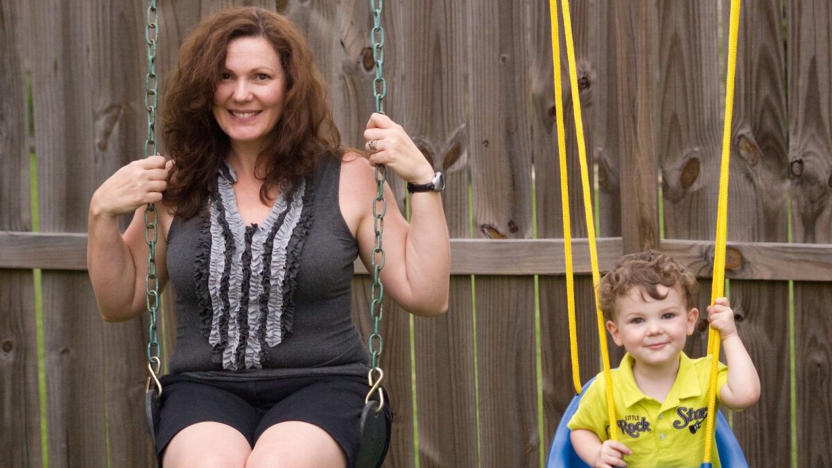 mother on swing with son