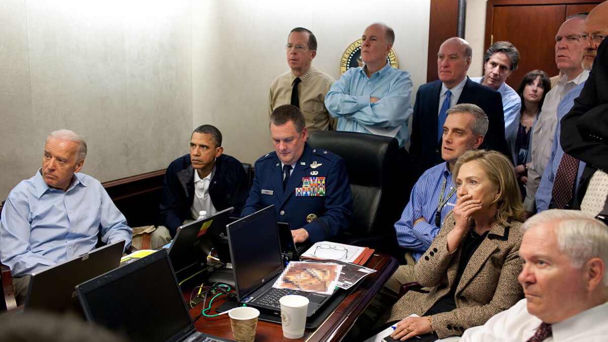Obama, Biden, Hillary Clinton, John Brennan, James Clapper, and others sit around a table
