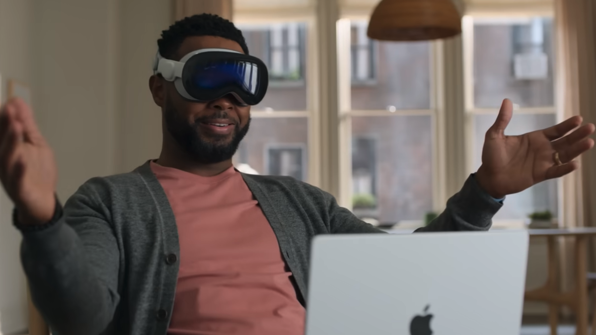 Man wearing Apple Vision Pro goggles