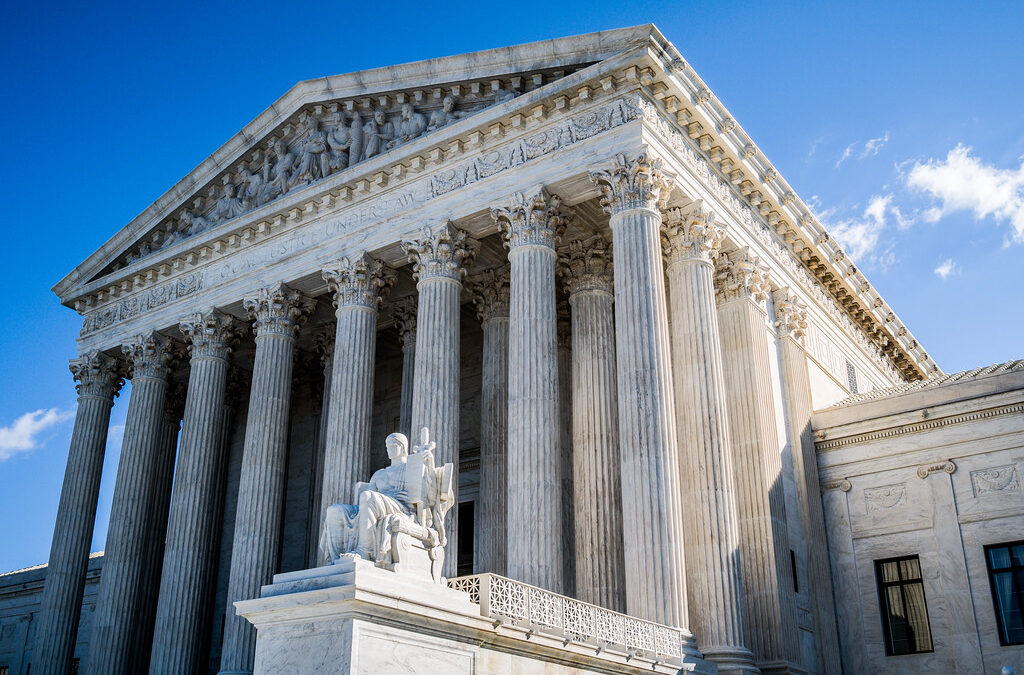 Photo of U.S. Supreme Cour building under blue skies.
