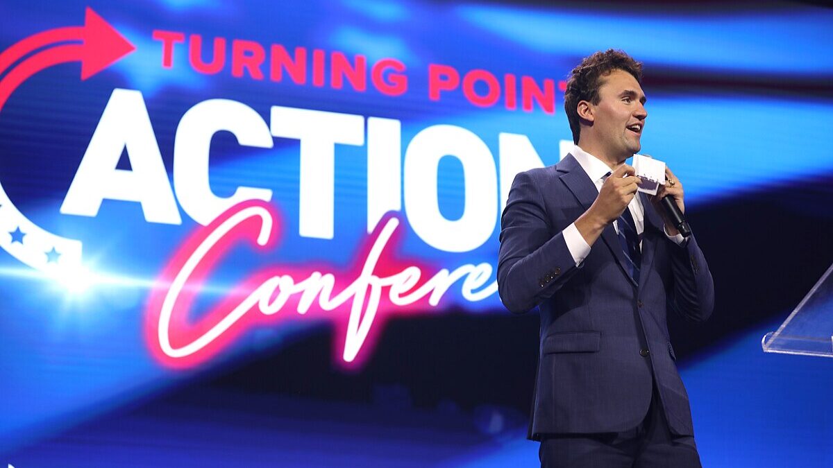Charlie Kirk speaking at Turning Point Action summit.