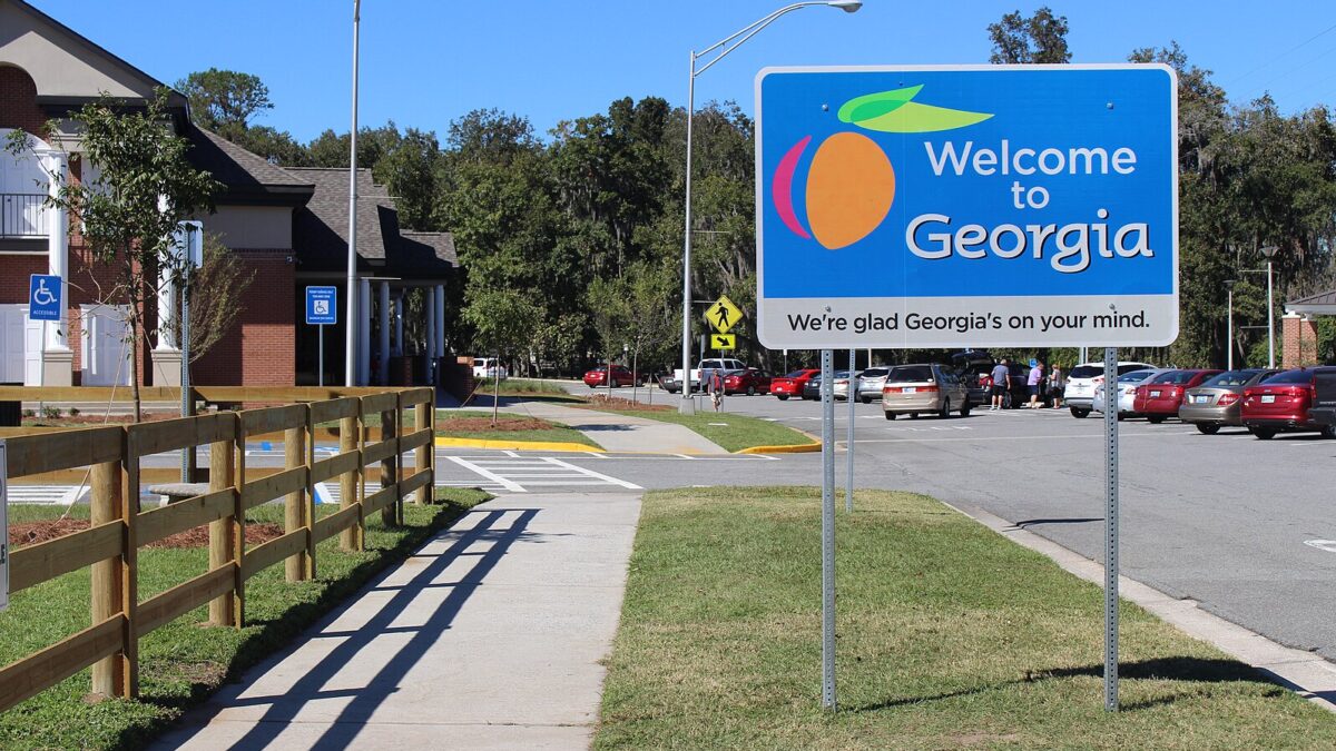 A sign in a community declaring, Welcome to Georgia.