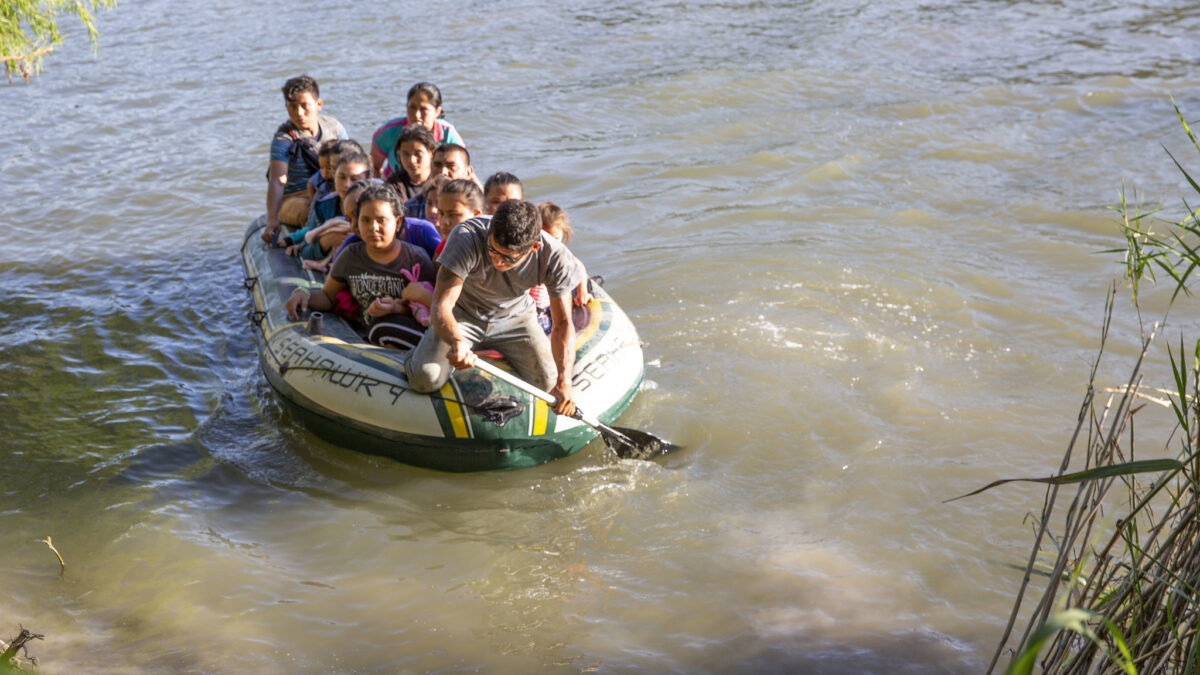 boat full of migrants crossing Rio Grande