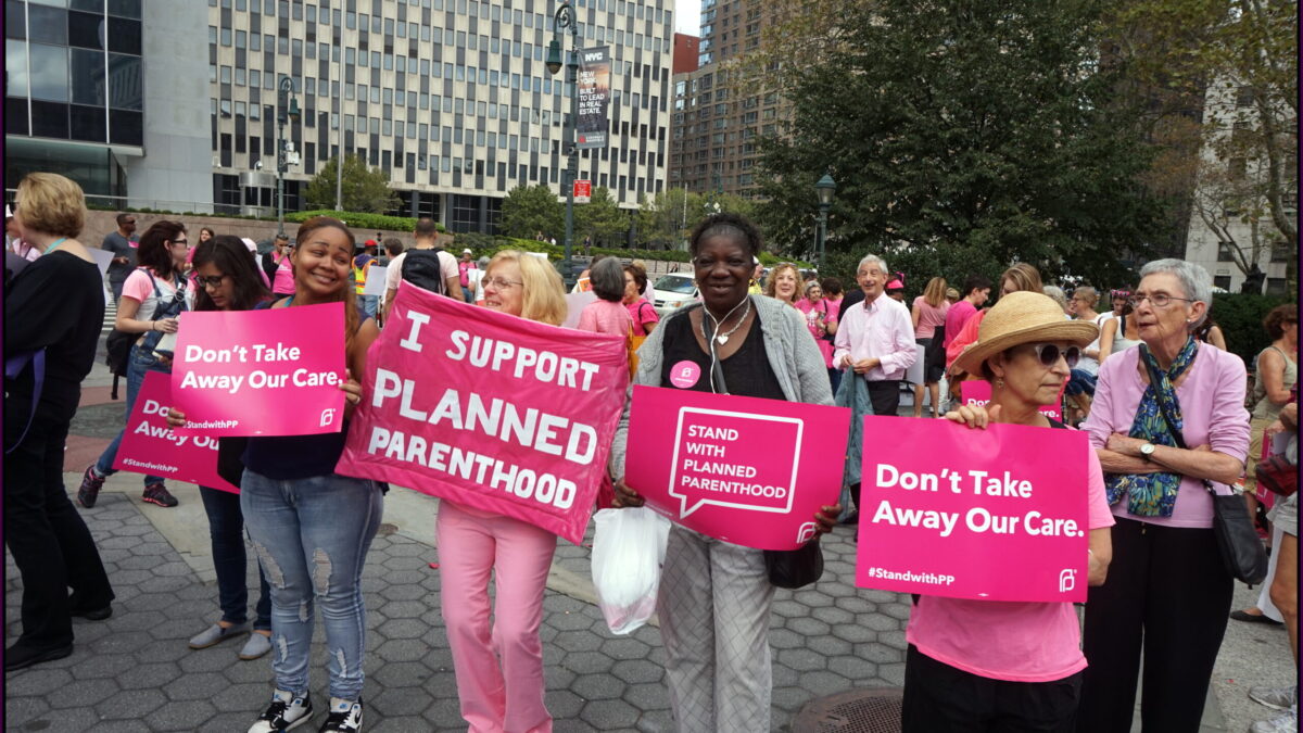 Planned Parenthood supporters wear pink in Pink-Out Rally.