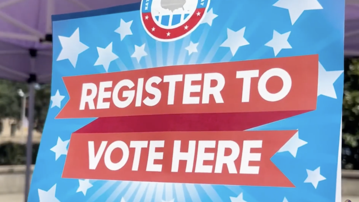 "register to vote here" sign
