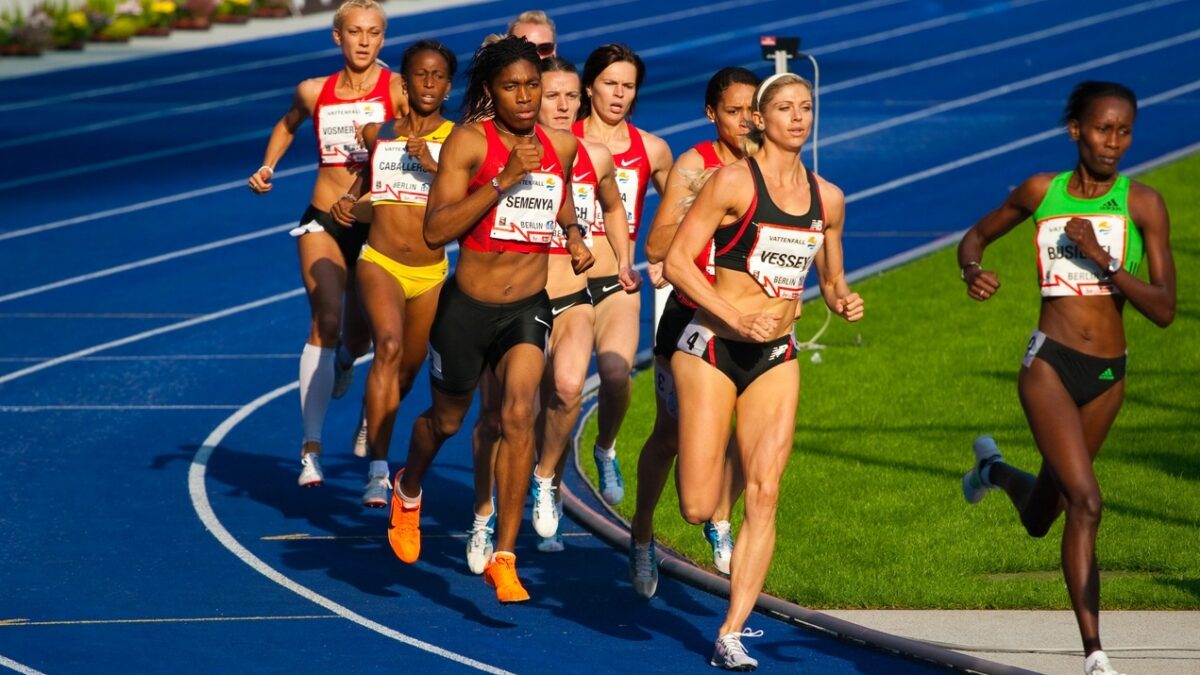 women running race around track