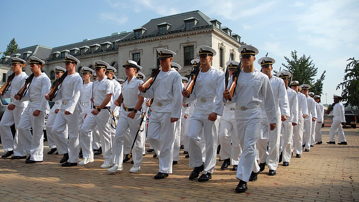 U.S. Naval Academy midshipmen participating in a parade.