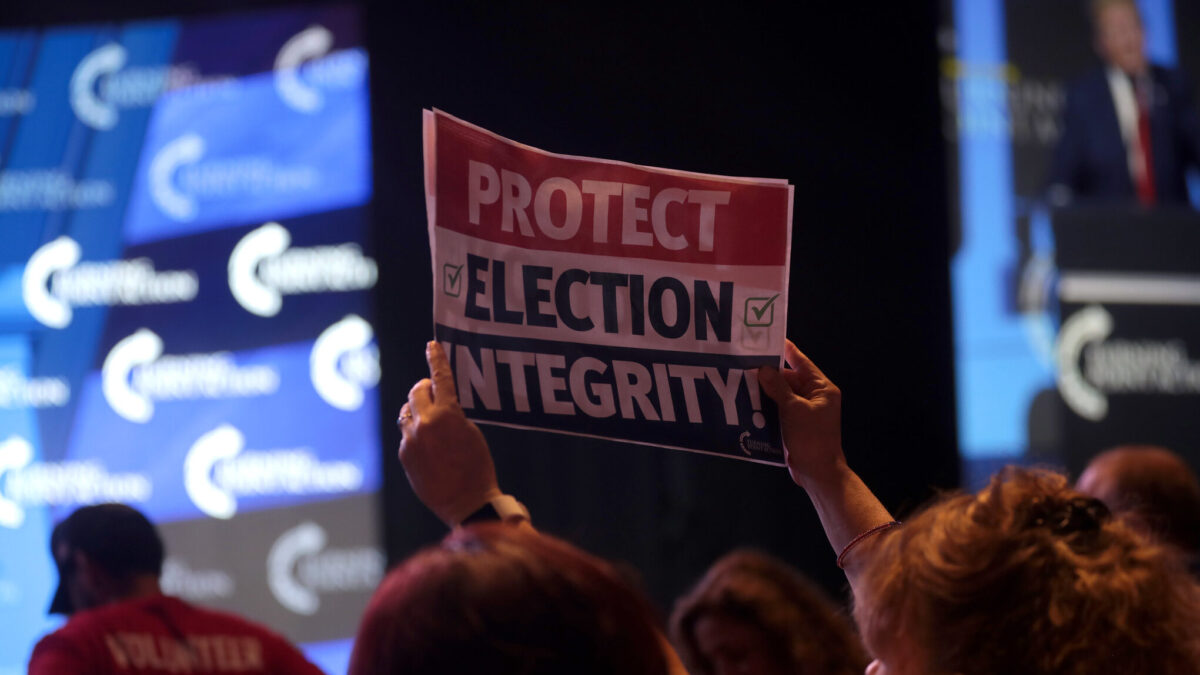 TPUSA guest holds election integrity sign