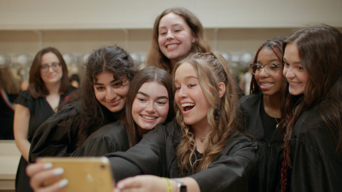 Teenage girls taking a selfie