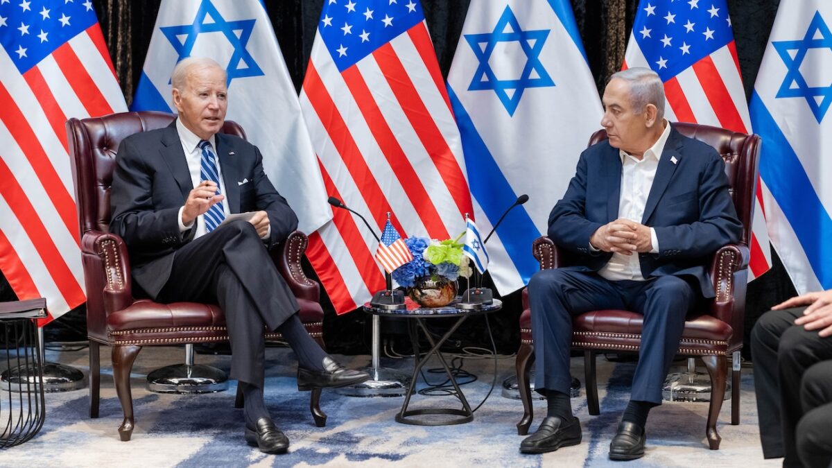 Joe Biden and Israel prime minister Benjamin Netanyahu in front of flags