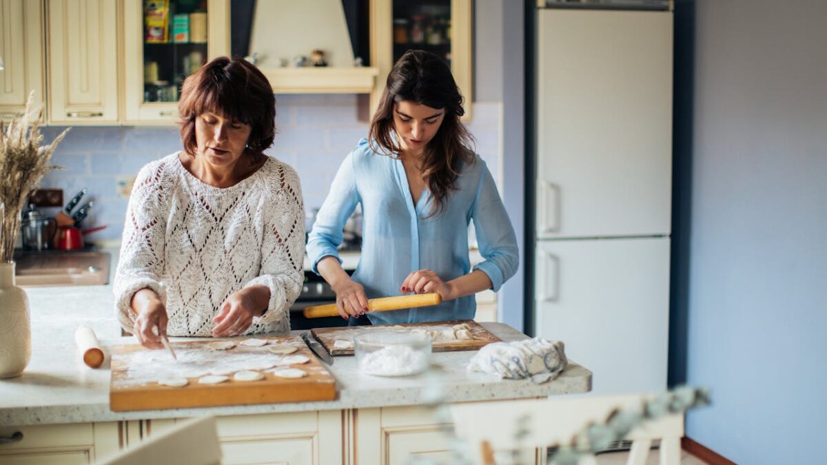 Mother and daughter baking together
