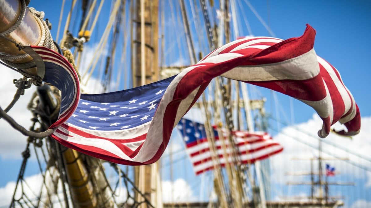 close up of American flag flying on a ship