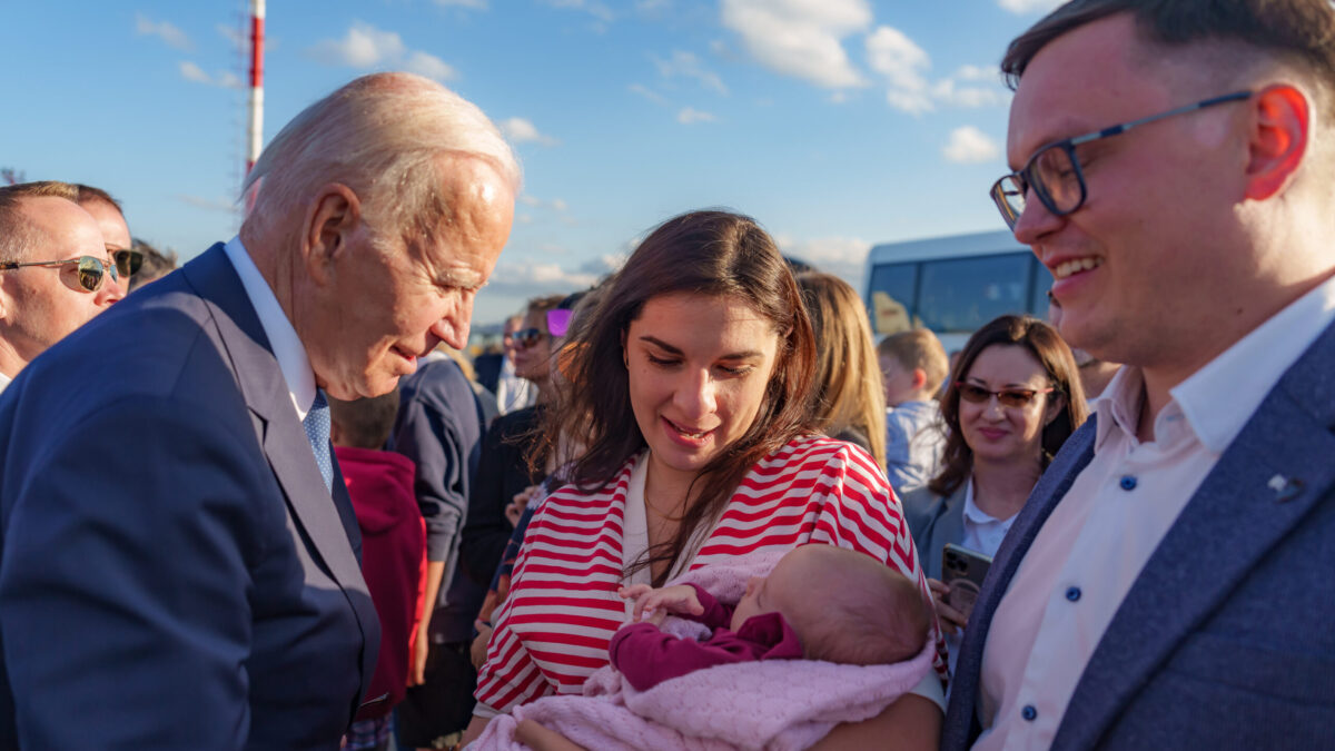 Joe Biden looks at baby