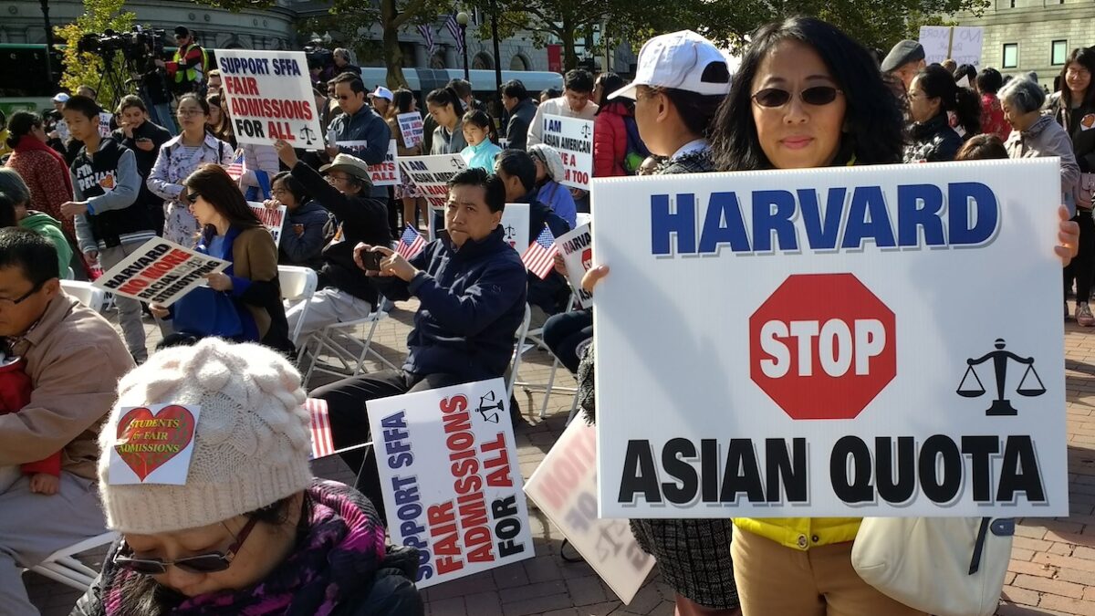 Activist holding affirmative action protest sign