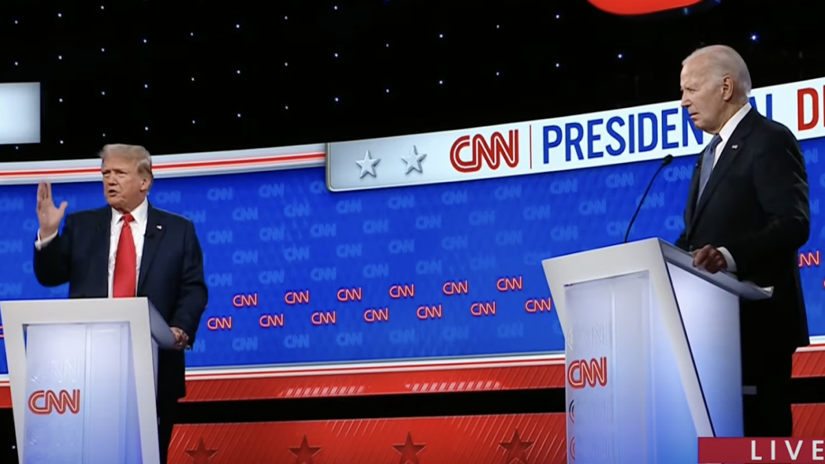 Trump and Biden at the presidential debate standing on podiums.