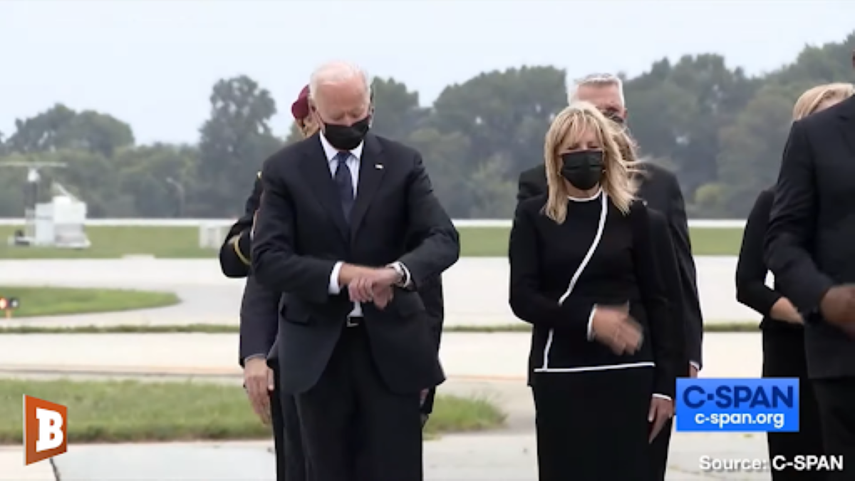 Biden checking his watch during U.S. soldier return from Afghanistan.