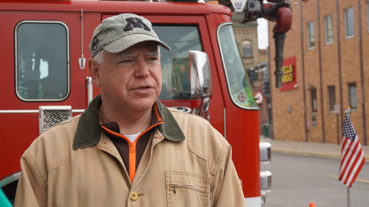 Don’t Let The Camo Hat Distract You From Walz’s Radical Record