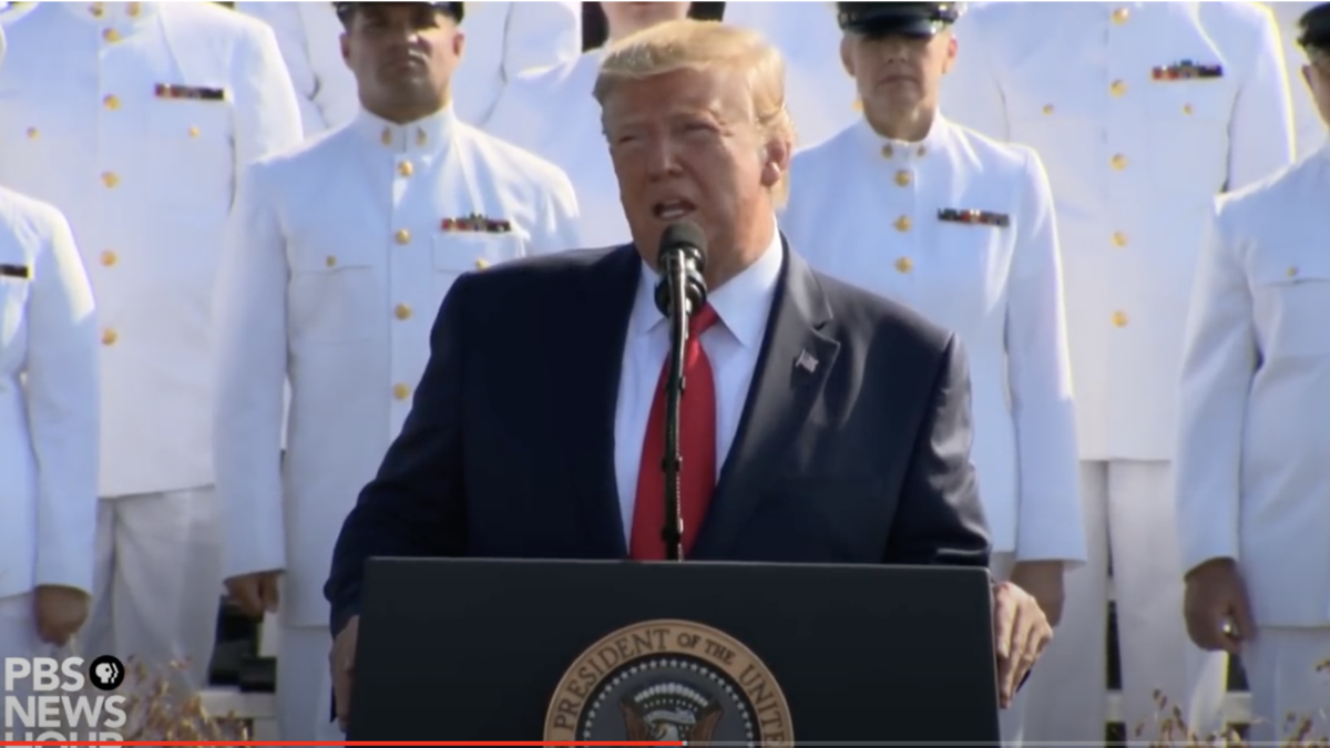 Then President Donald Trump taking part in a 9/11 remembrance ceremony.