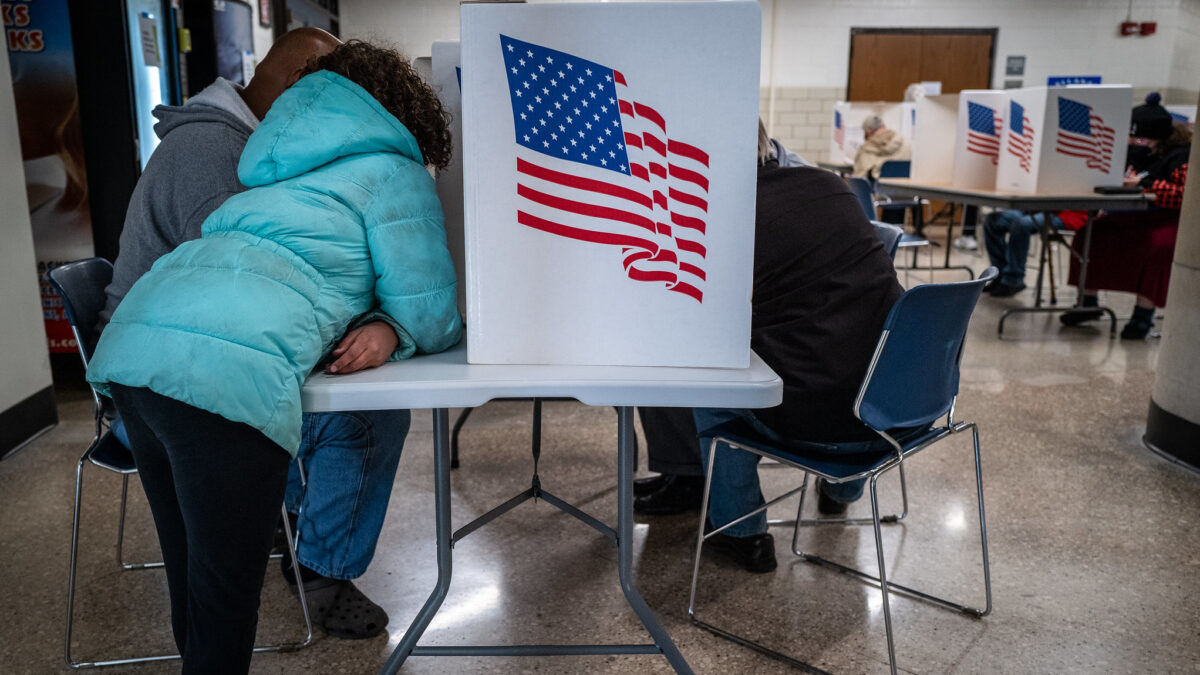 Voter casting ballot