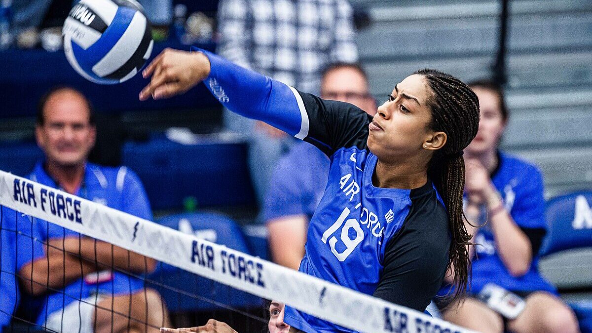 Air Force volleyball player hitting the ball.