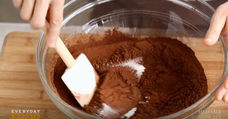 Woman making homemade hot chocolate mix.