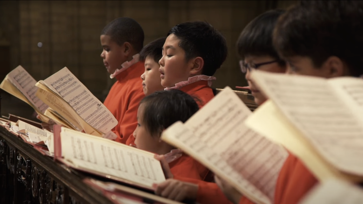 St. Thomas Choir School boys singing in a line