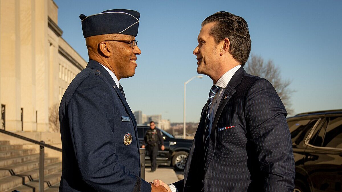 Pete Hegseth shaking hands with Charles Brown.