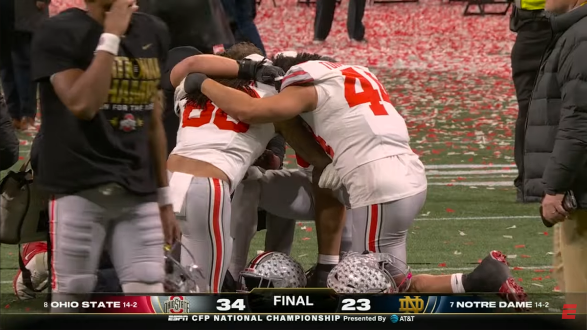 Ohio State football players praying.