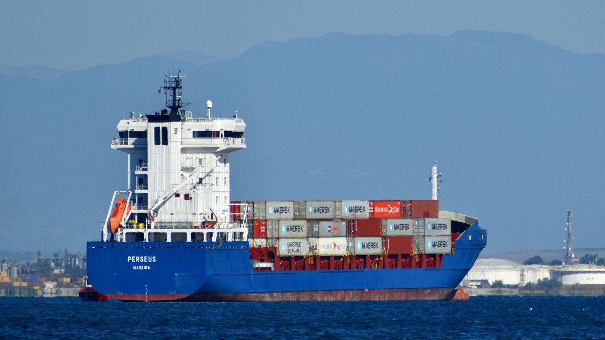 blue and white cargo ship at sea