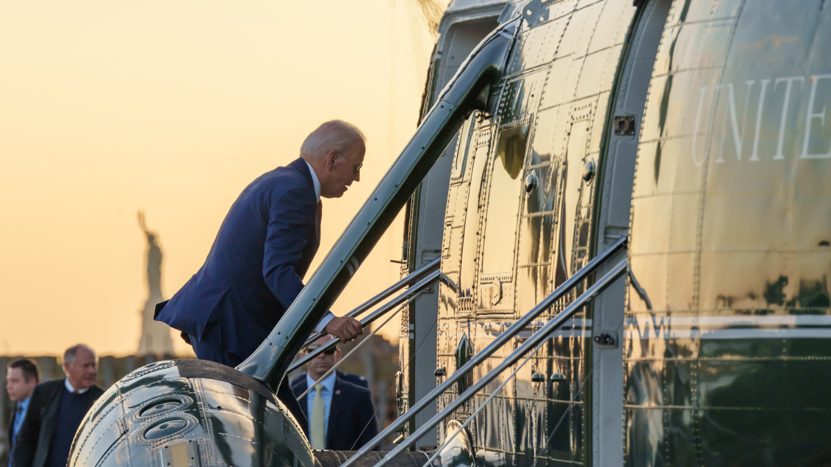 Biden walks up stairs to Marine One