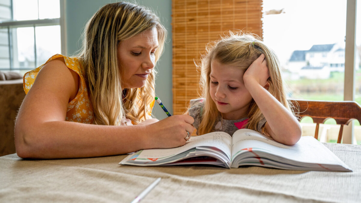 Rachel Young teaches her 8-year-old daughter, Melody, math concepts at their home in Magnolia, Del., April 5, 2022. Young is a full-time stay-at-home mother and homeschools her children. Young has been a military spouse for 12 years and said her husband’s unit has been a great and supportive community. (U.S. Air Force photo by Airman 1st Class Cydney Lee)