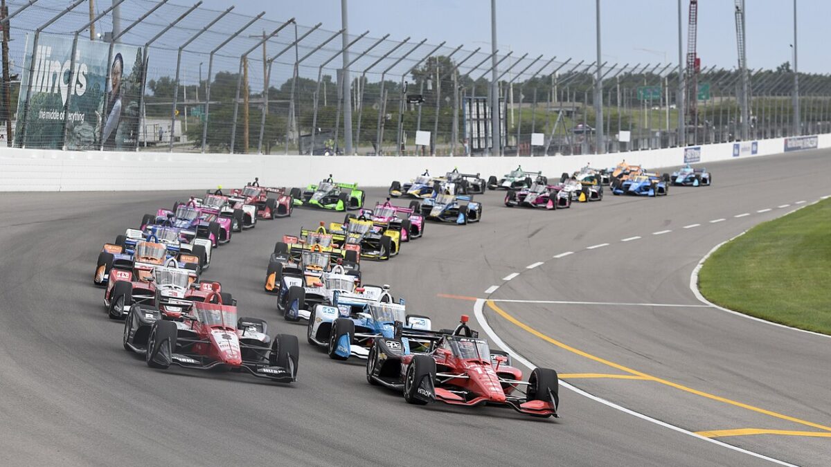 Cars racing on IndyCar track