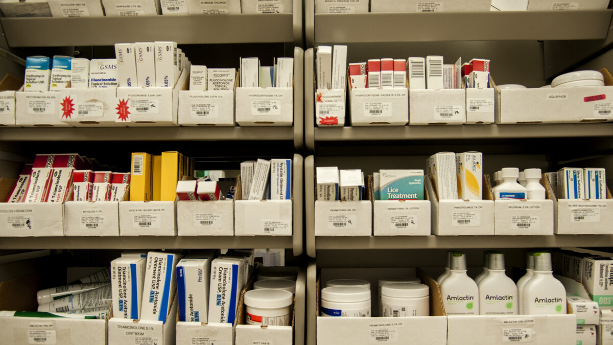 pharmacy shelf with boxes of drugs