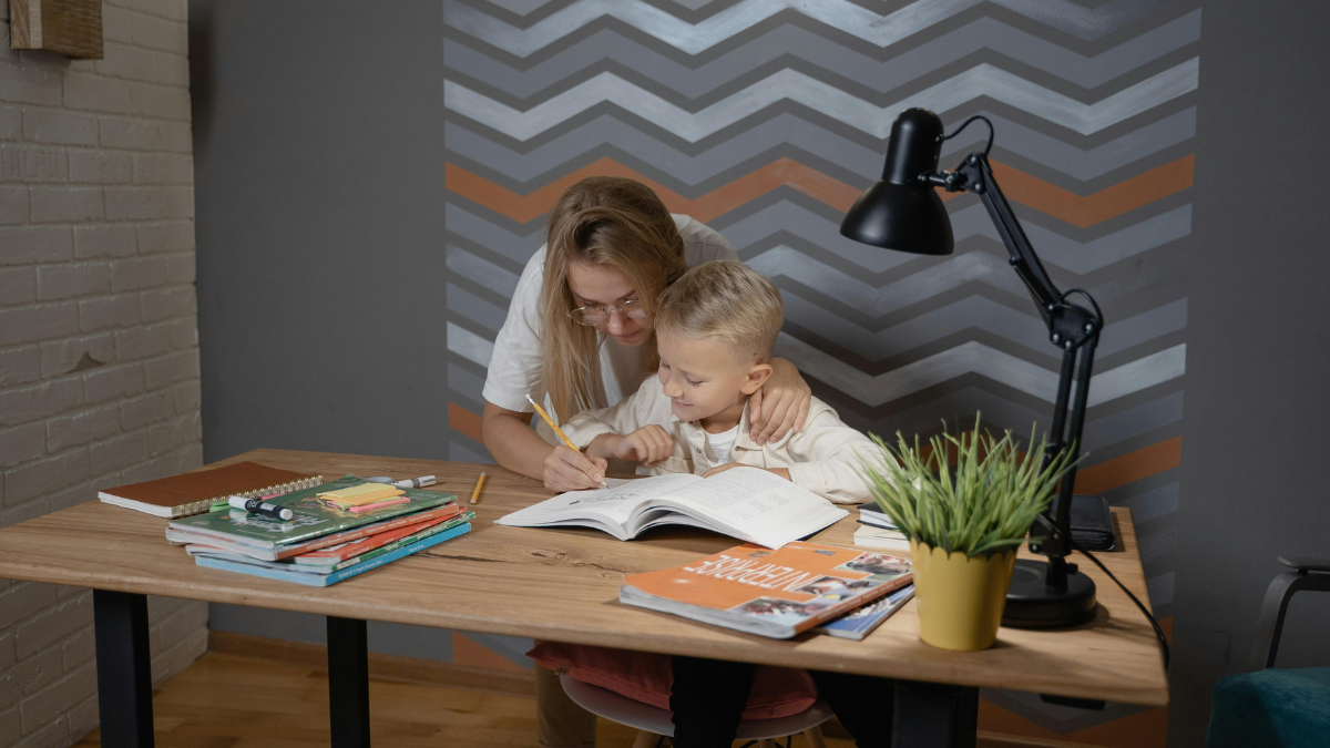 mother helping son with school work