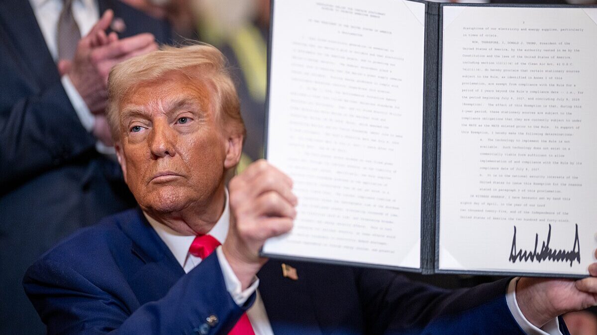 Donald Trump signing an executive order.