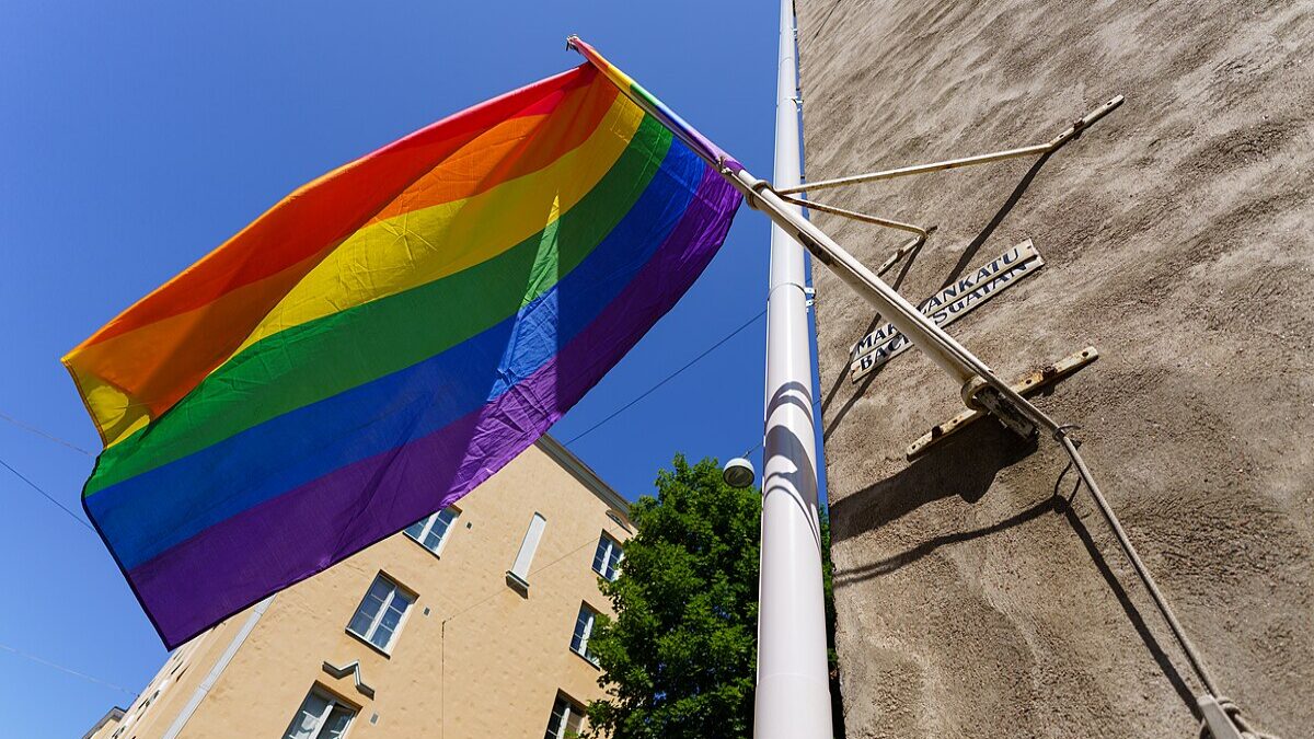 LGBT flag flying.