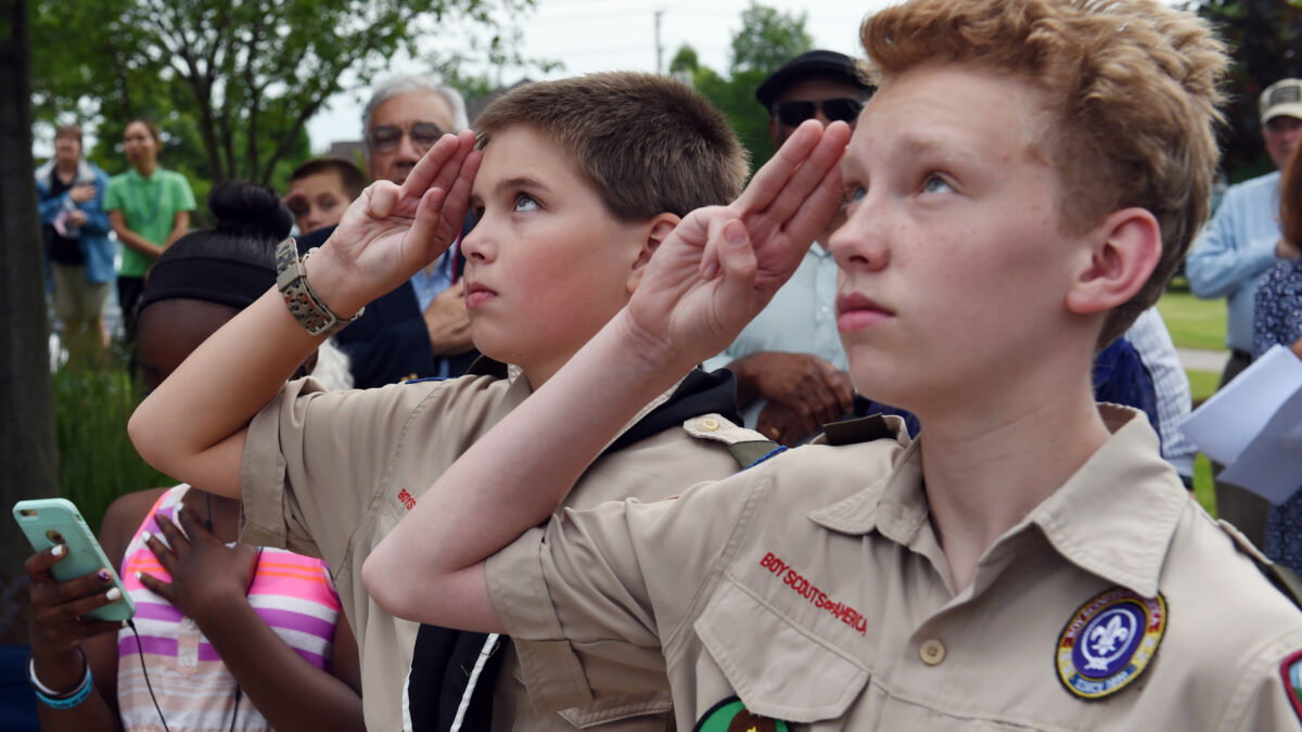 Buffalo Grove - Jacob Hammon, left, and Hayden Gantt, salute the American Flag as it is raised up the flag pole in Veterans Park in Buffalo Grove Illinois, June 14, 2016. Both scouts are members of Troop 79, Boy Scouts of America. (U.S. Army photo by Sgt. Aaron Berogan/Released)