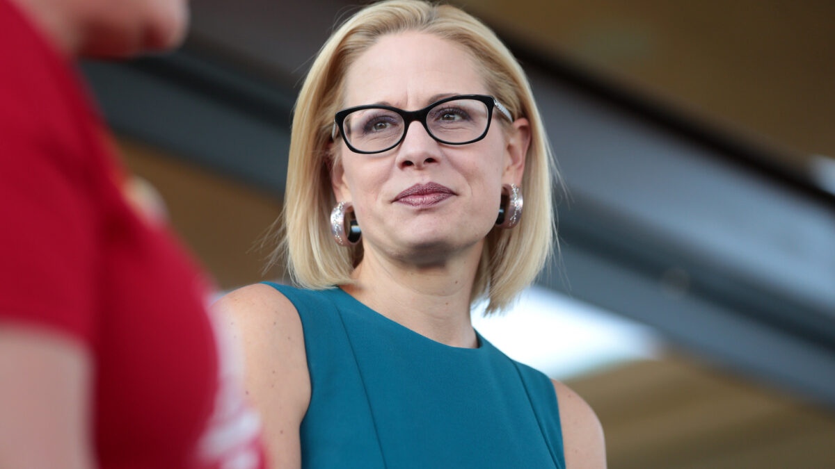Kyrsten Sinema in blue dress