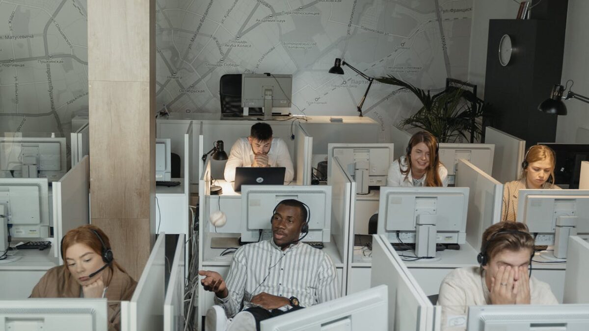 people in cubicles of a call center