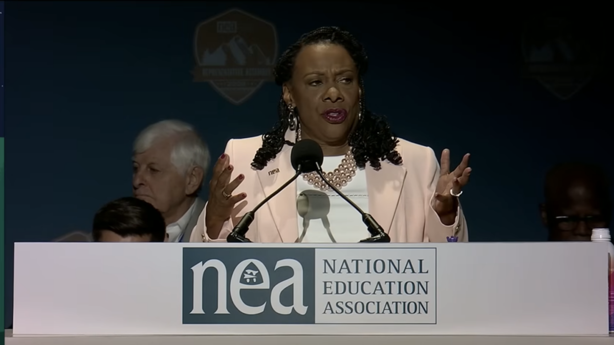 black woman speaking at conference