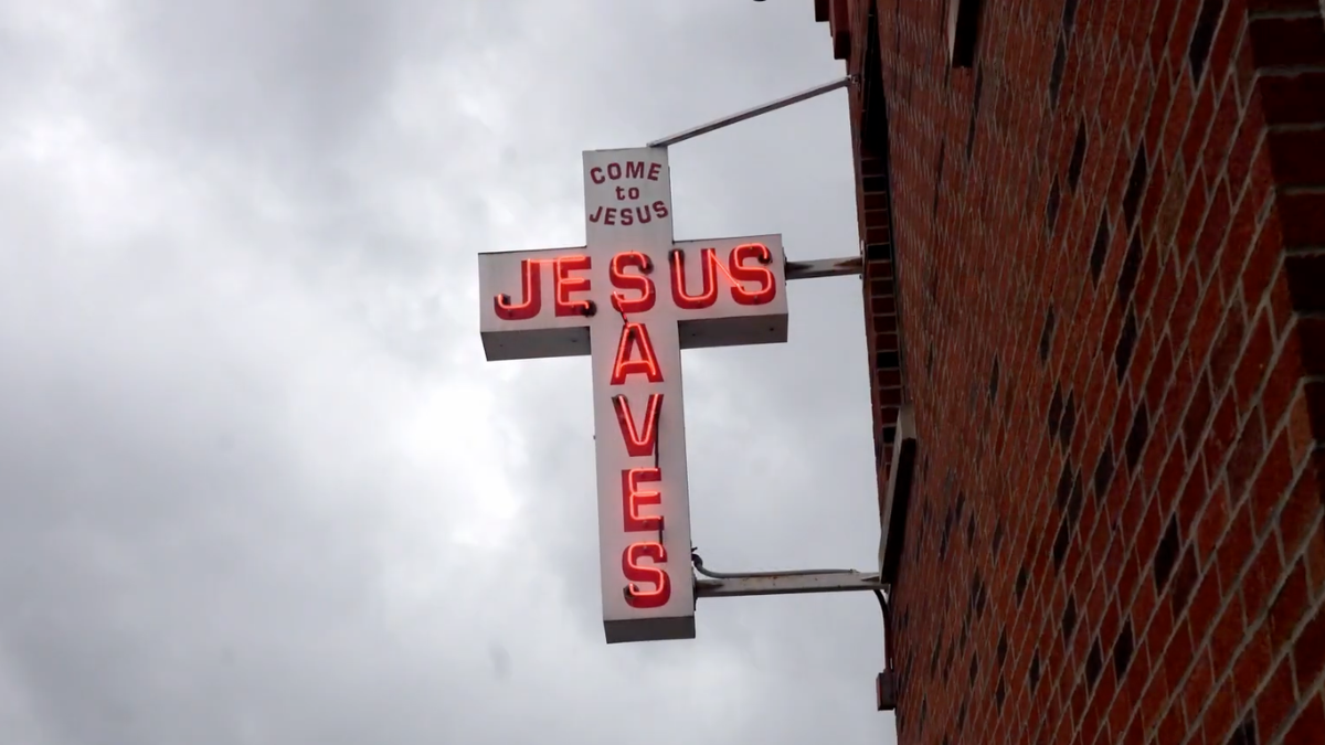 Capital City Rescue Mission building and Jesus Saves cross
