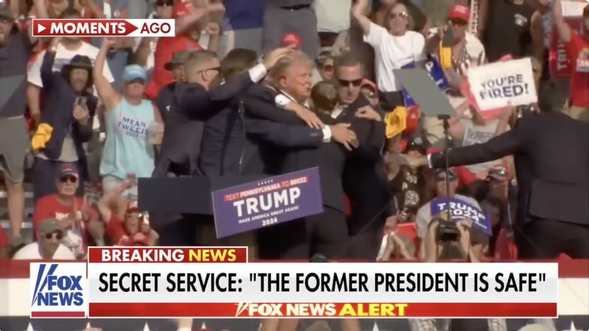 Donald Trump standing up movements after a gun attempted to assassinate him in Butler, Penn.