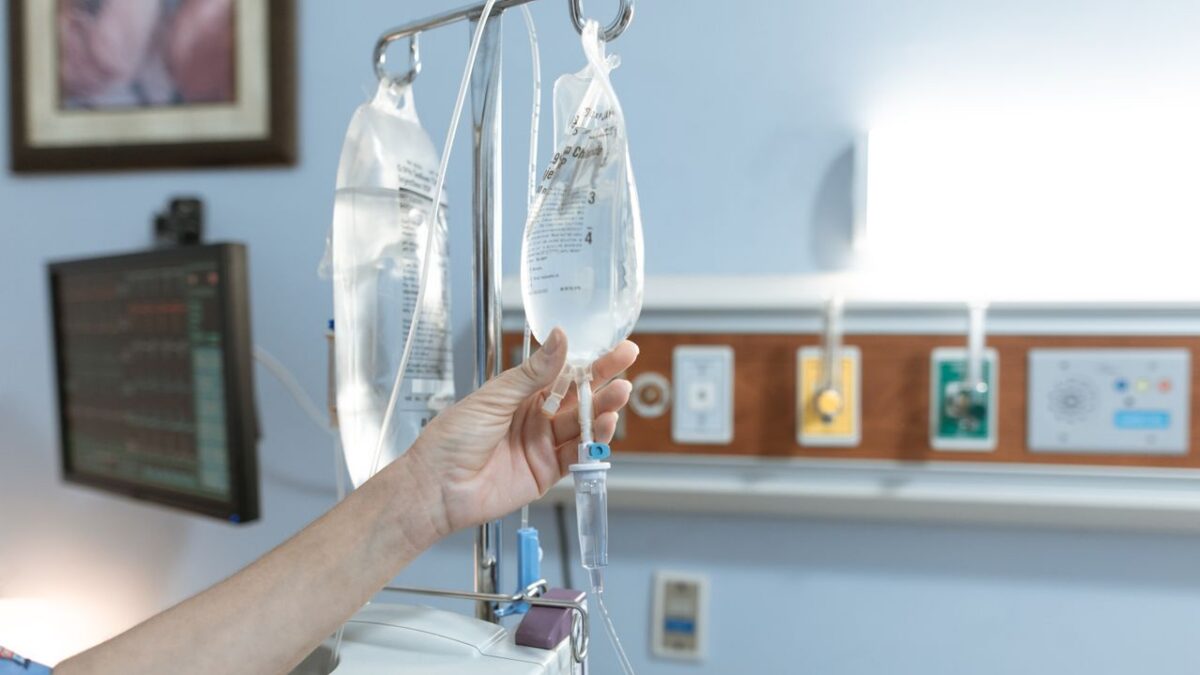person monitoring IV bag