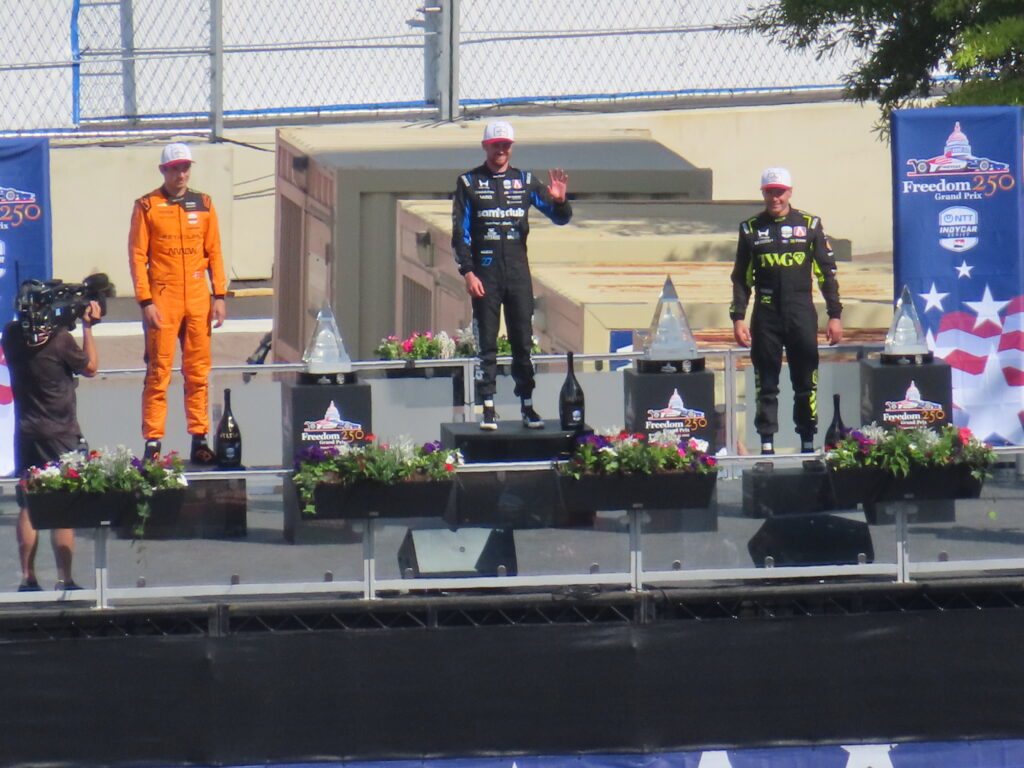 freedom 250 grand prix winners' podium