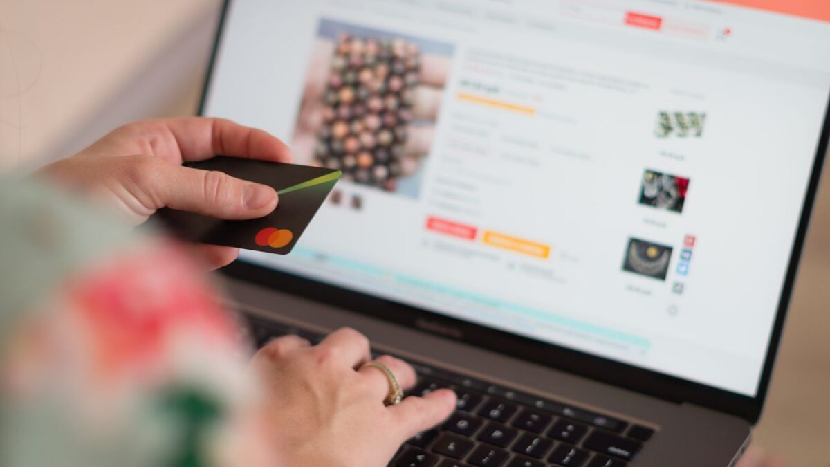 woman with credit card and laptop